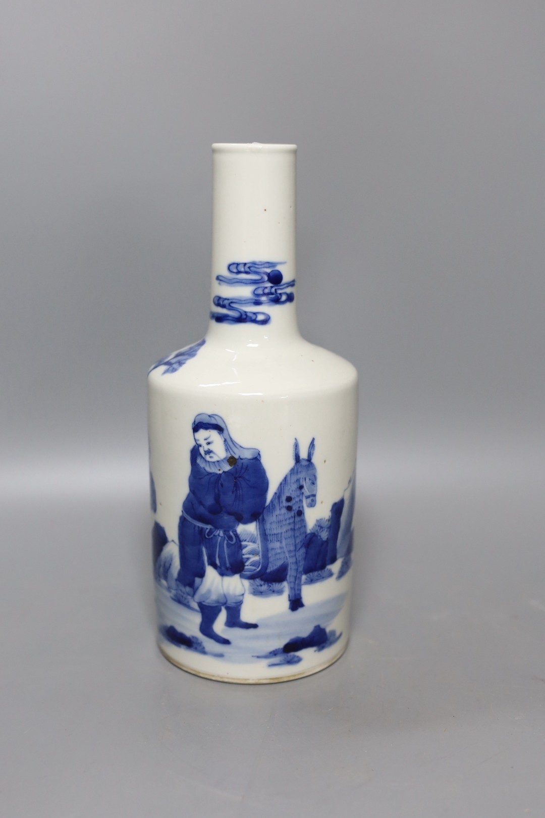 A 19th century Chinese blue and white figural bottle vase, 24cm